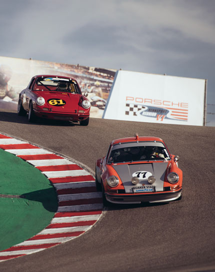 Porsche 911 cars at the corkscrew bend Laguna Seca California